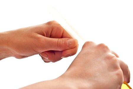 File and woman's hands isolated on whiteの写真素材