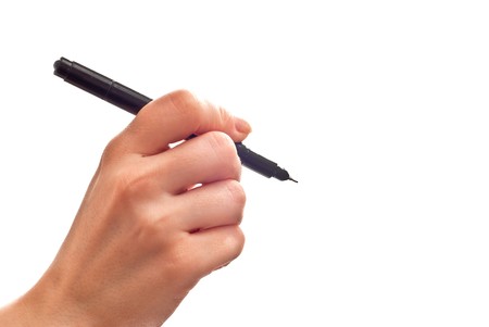 Woman's hand with black pen isolated on whiteの写真素材