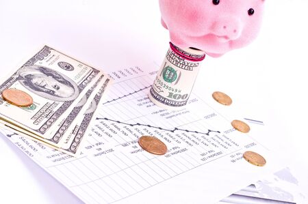 Business chart, money, and piggy bank isolated on whiteの写真素材