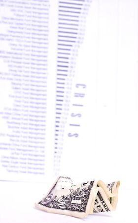 rumpled one dollar and chart isolated on white. Focus on dollarの写真素材