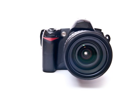 Modern digital camera equipped with zoom lens isolated on whiteの写真素材