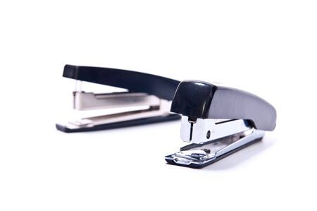 Two black staplers isolated on white backgroundの写真素材