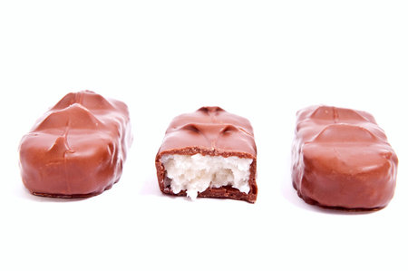 Pile of chocolate chunks isolated on white background