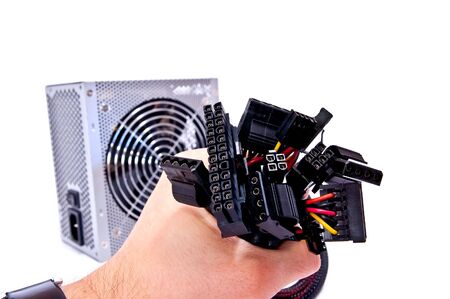 Black wires in man hand on white background
の写真素材