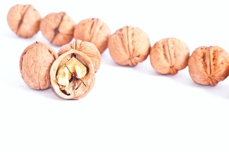 walnuts lie on a table. Isolated on whiteの写真素材