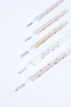 Medical four termometers on grey backgroundの写真素材