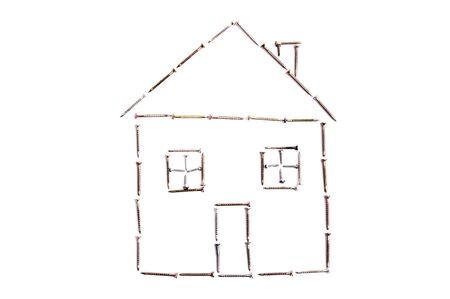 Model of house from steel screws isolated on whiteの写真素材