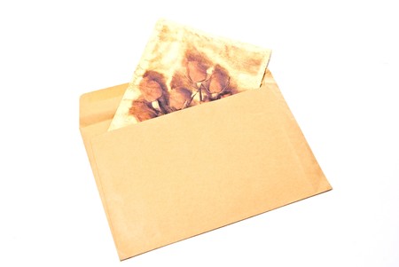 Postal card in envelope isolated on white backgroundの写真素材