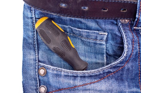Yellow and black screwdriver in jeans pocketの写真素材