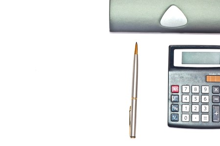Gold and silver pen with calculator isolated on whiteの写真素材