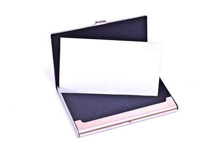 Business card in metal card holder isolated on whiteの写真素材