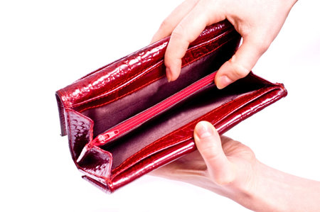 A leather red wallet and hand isolated on white