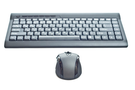 PC keyboard and mouse isolated on white. Focus on mouse