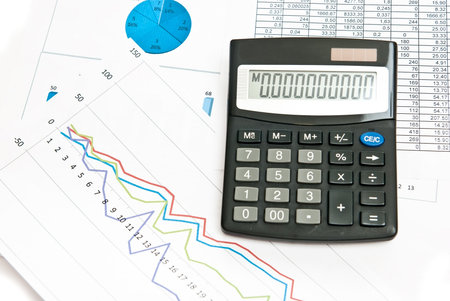 Close-up on stock market data chart and calculator.