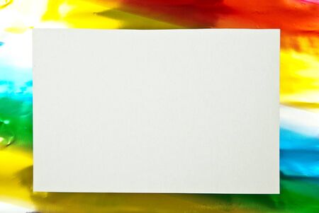 White paper blank on colored background. Studio shotの写真素材