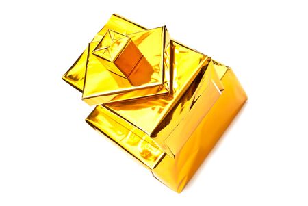 Four golden gifts boxes isolated on whiteの写真素材