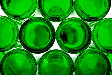 Bottoms of empty glass bottles on white backgroundの写真素材