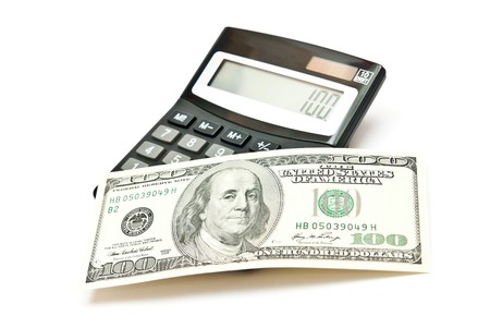 Calculator and 100 dollars. isolated on white backgroundの写真素材