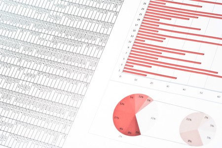 Business still-life with red diagrams, charts and numbersの写真素材