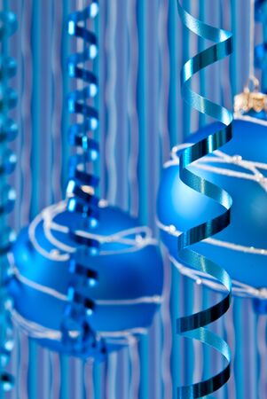 Christmas decoration from two blue balls and ribbons. Focus on ribbonの写真素材