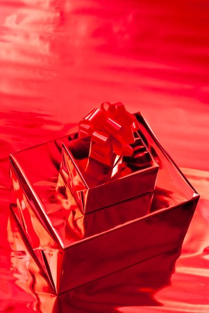 Gift box and christmas toys. Red backgroundの写真素材