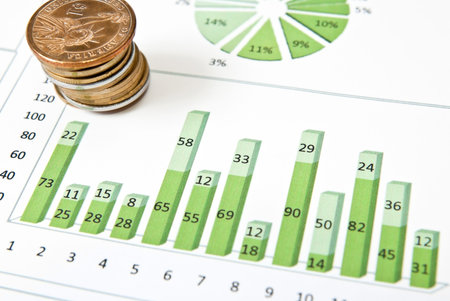 Business diagram with stack of coins. Studio shot
