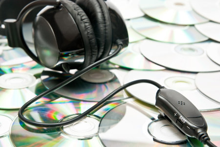 Black headphones on cd background