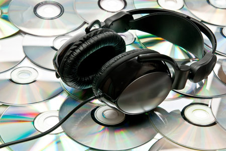 Black headphones on cd background