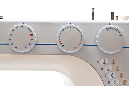 Details of sewing machine on white background