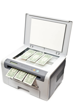 Grey laser printer and dollars isolated on white backgroundの写真素材