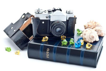 Vintage camera  and photo album. Isolated on white