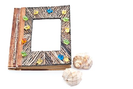 Old-fashioned photo album with empty picture. Isolated on whiteの写真素材