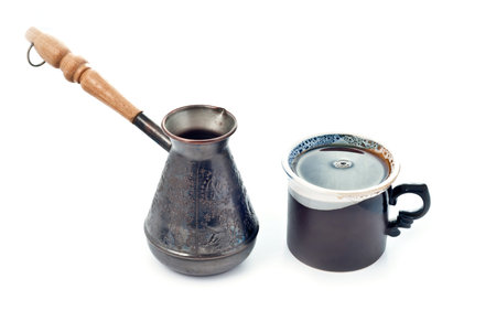 Cup of coffee and metal coffee potの写真素材