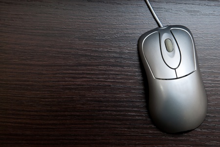 Single silver pc mouse on table. Studio shotの写真素材