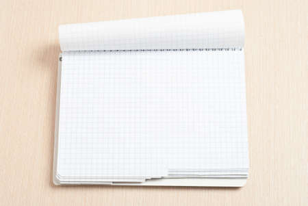 Blank spiral note pad on wood deskの写真素材