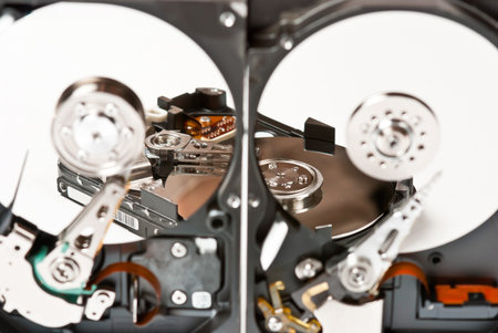 Opened hard disks on white background.