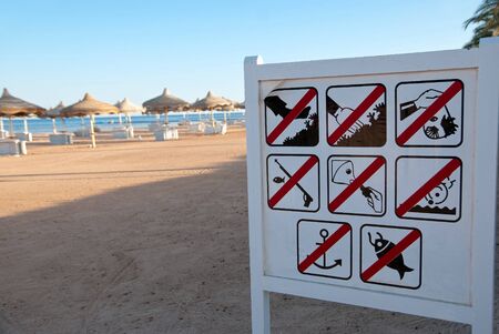 Beach sign near seaの写真素材