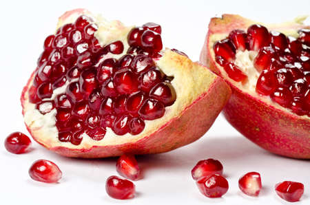 Pomegranate with grains isolated on whiteの写真素材