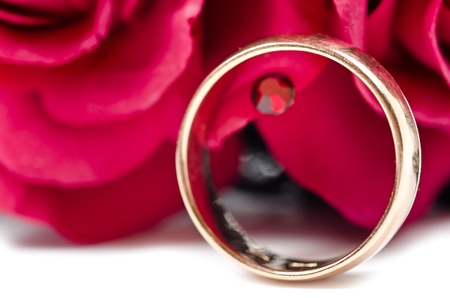 Golden ring with with red flowersの写真素材