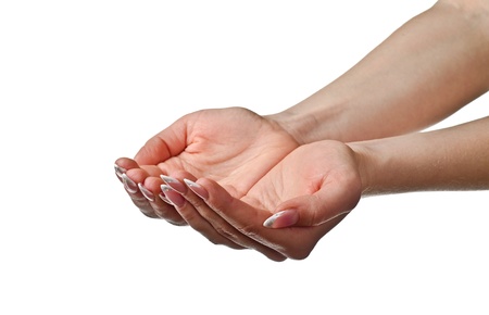 Beautiful woman's cupped hands. Isolated on white backgroundの写真素材