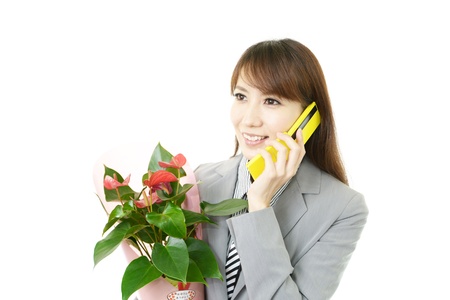 Smiling woman with a giftの写真素材