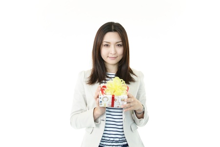 Smiling woman with a giftの写真素材