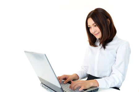 The female office worker who works in front of a PCの写真素材