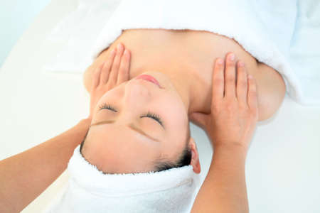 Woman receives body massage at spa salonの写真素材