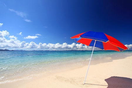 The beach and the beach umbrella of midsummer の写真素材