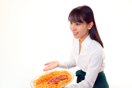 Smiling waitress carrying a mealの写真素材
