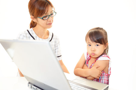 beautiful little girl using a laptop
