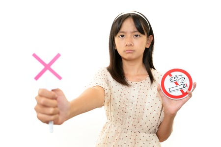 Girl with a mark of non smokingの写真素材