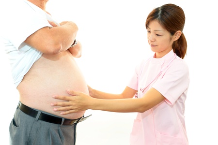 Woman doctor with a medical examination in obese patientsの写真素材
