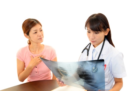 The woman doctor who explains a result of the inspectionの写真素材